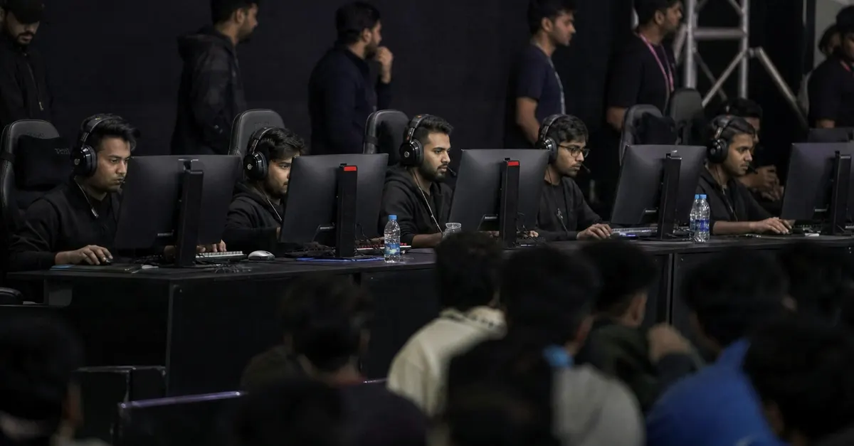Esports teams compete at a packed arena during a championship final.