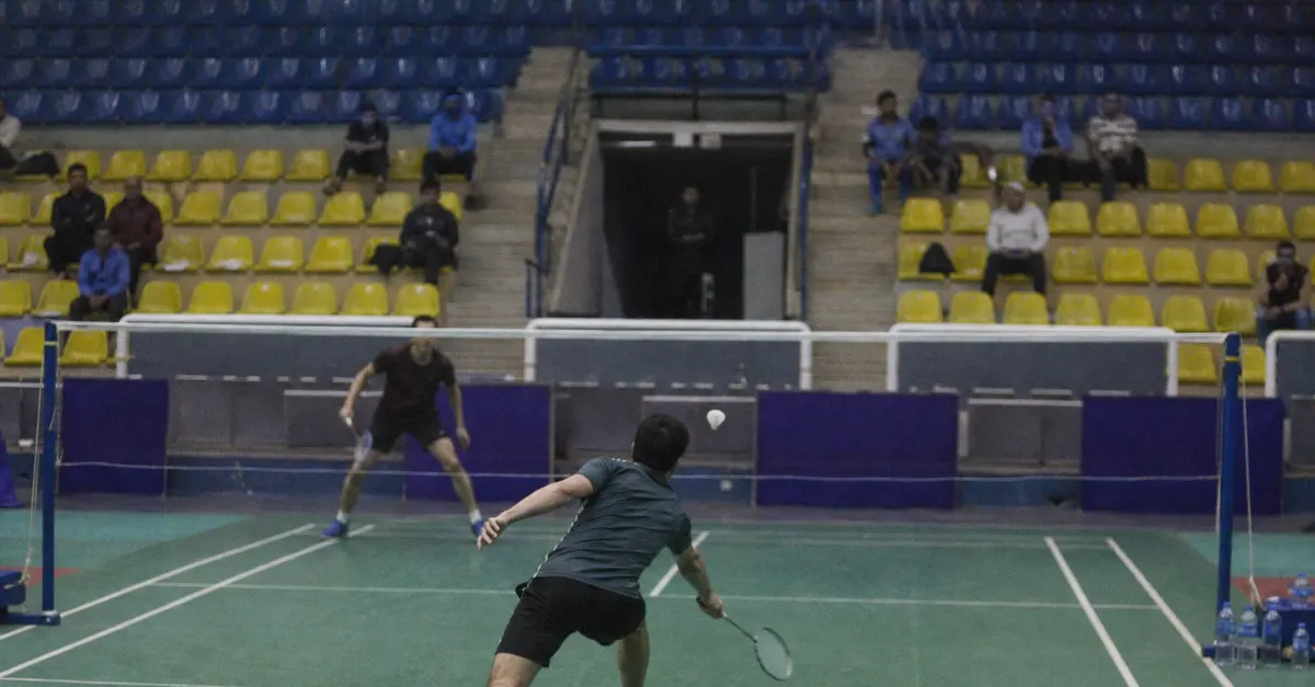 Anonymous badminton players compete during an indoor tournament in Cairo.
