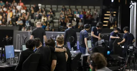 Anonymous esports players react after a tense tournament match.