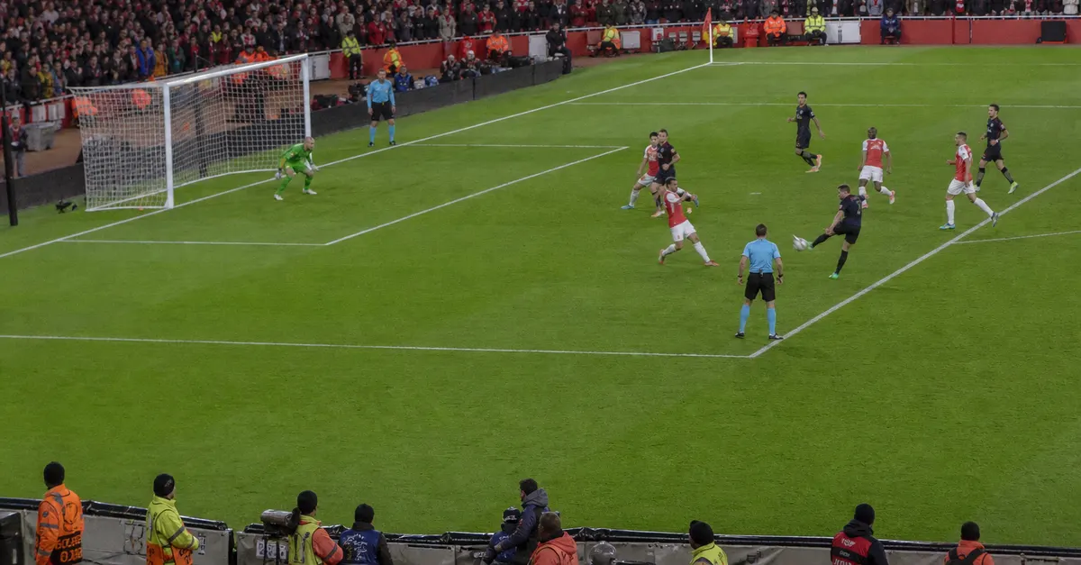 Anonymous midfielder celebrates a late equaliser during a European football match.