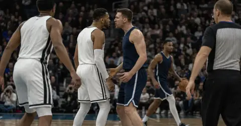 Anonymous basketball players exchange words during a professional game